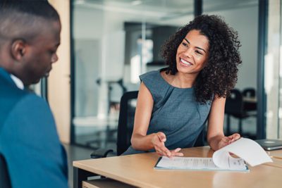 Female Banker Assisting A Customer The Federal Savings Bank