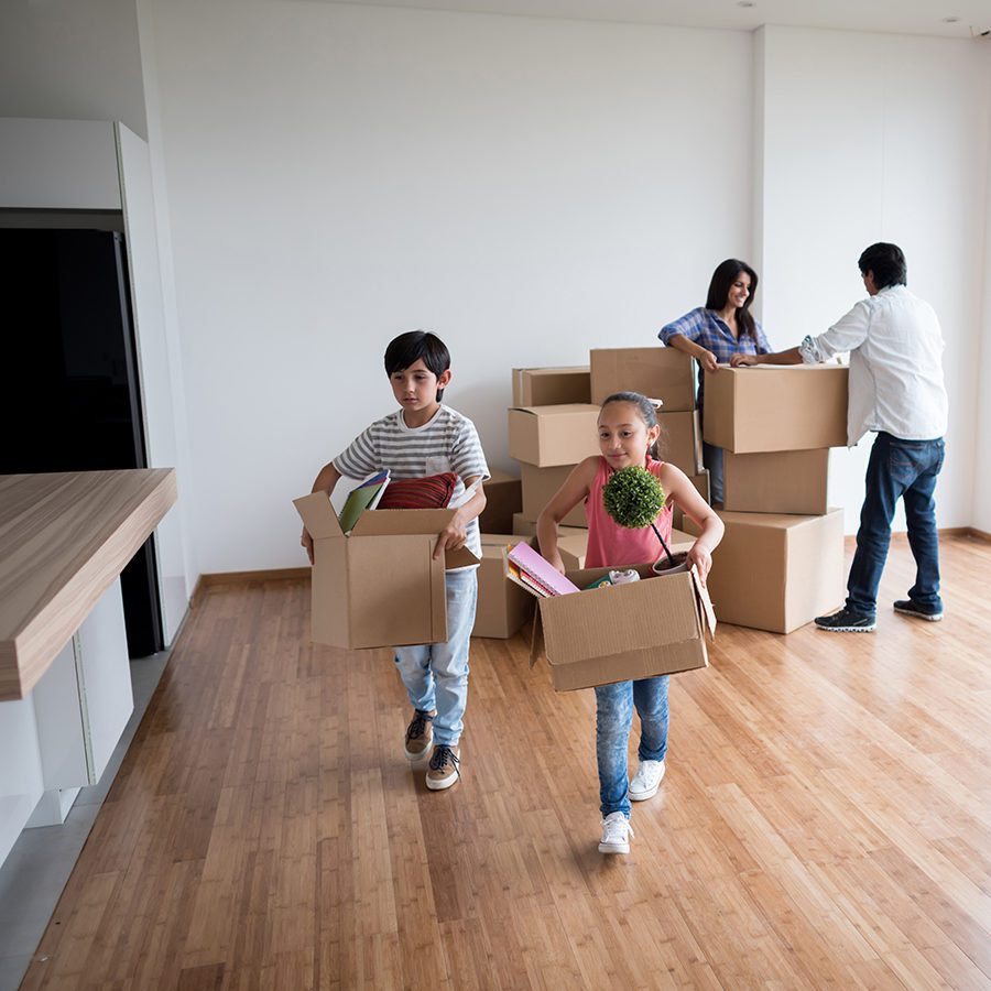 Young Family Moving Into Their New Home