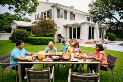 Family Gathered for Dinner in Backyard