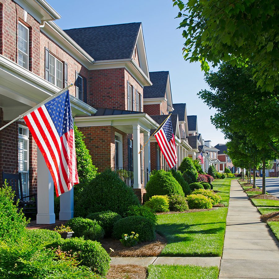 Street of Homes with American Flags Hanging