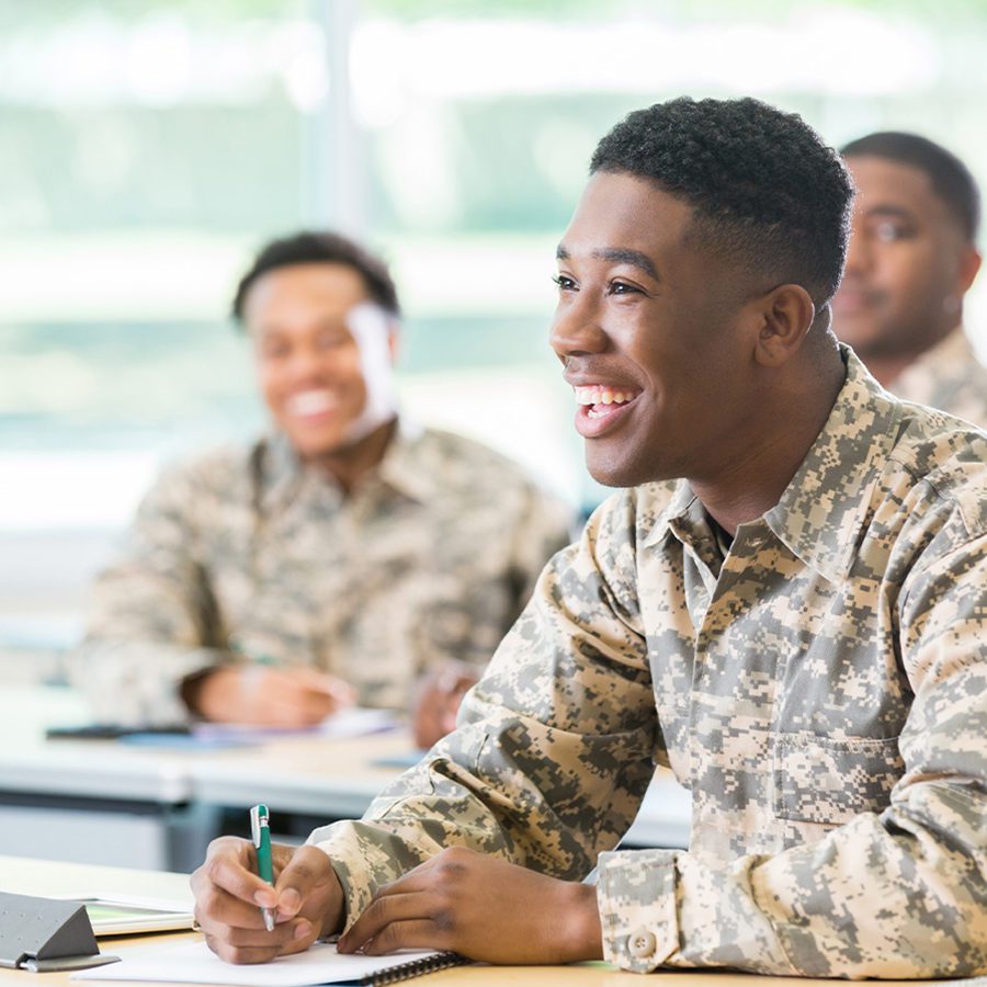 Soldier Laughing While Learning in a Classroom