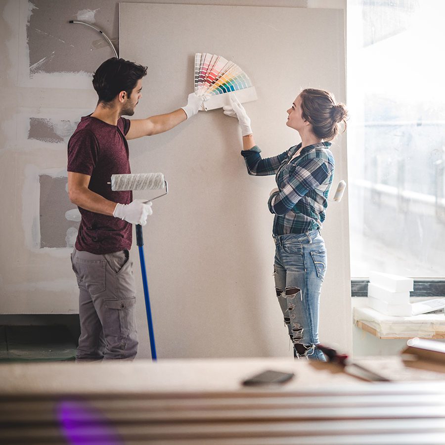 Couple Deciding on Colors to Repaint a Wall