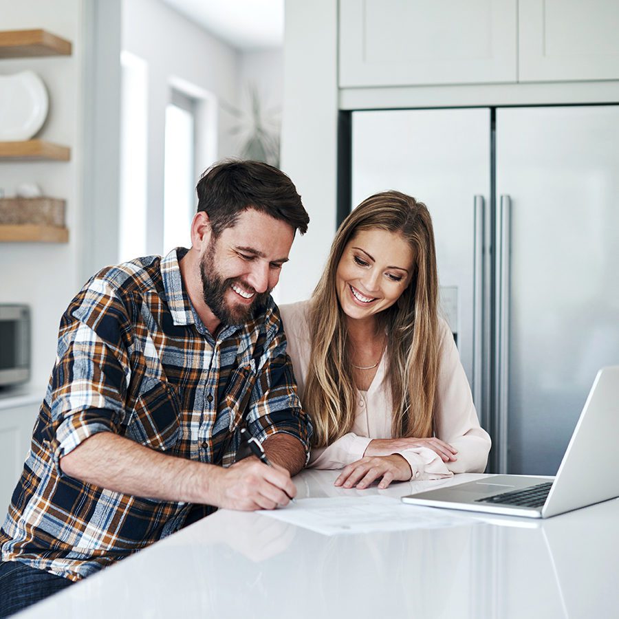 Couple Working on Their Finances in Their Kitchen