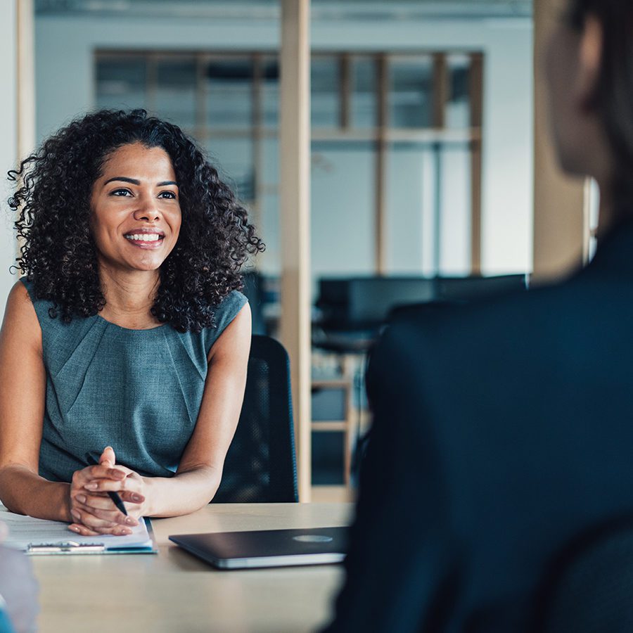 Woman Smiling in a Meeting