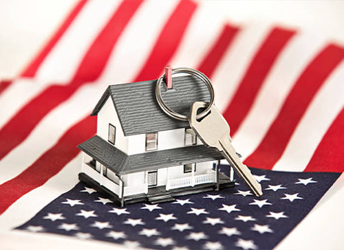 House keychain with a key on top of an American flag