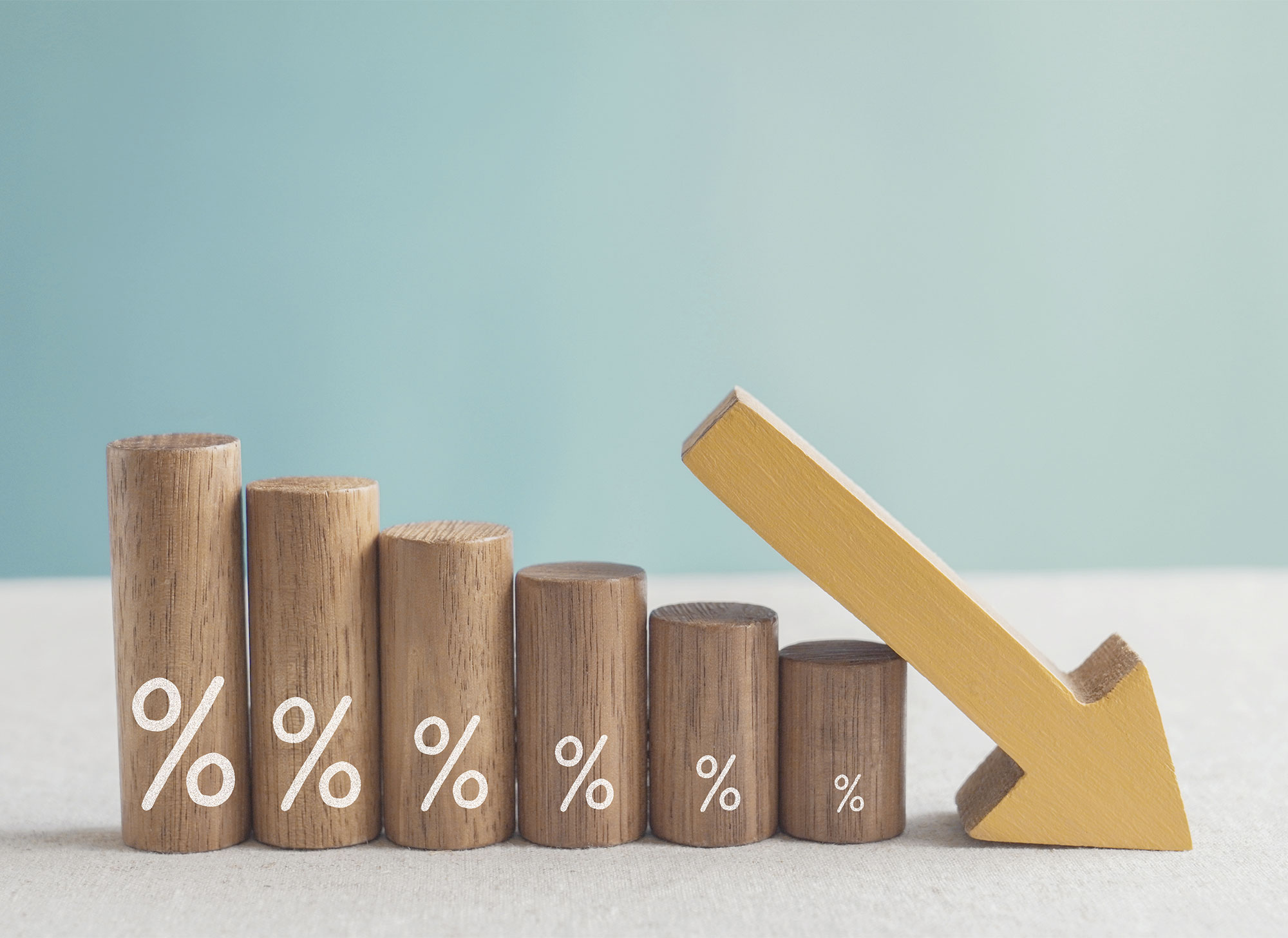 stack of differently sized cylindrical woods with percentage symbol of them.