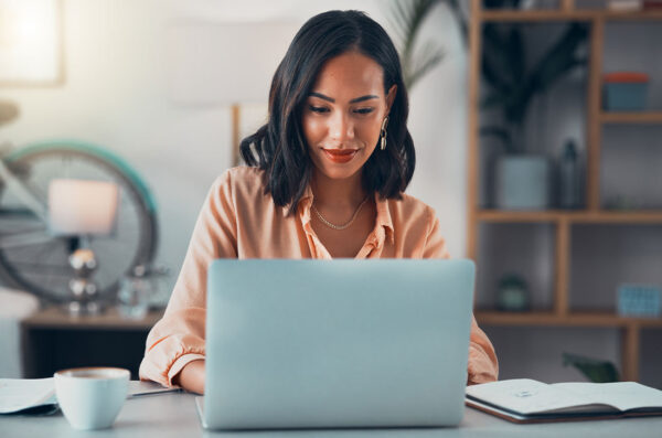 Woman working on laptop.