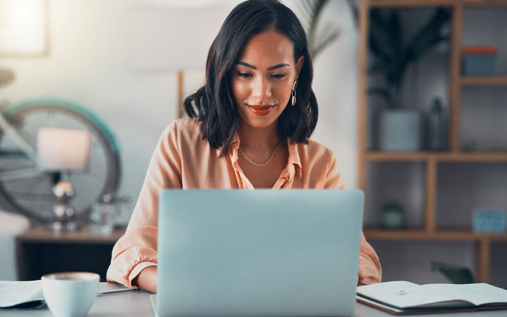 Woman working on laptop.