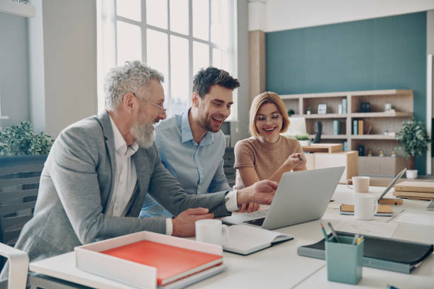 Young couple reviewing their financials with a professional advisor.