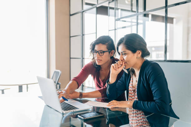 Woman looking over her financials with a financial professional.