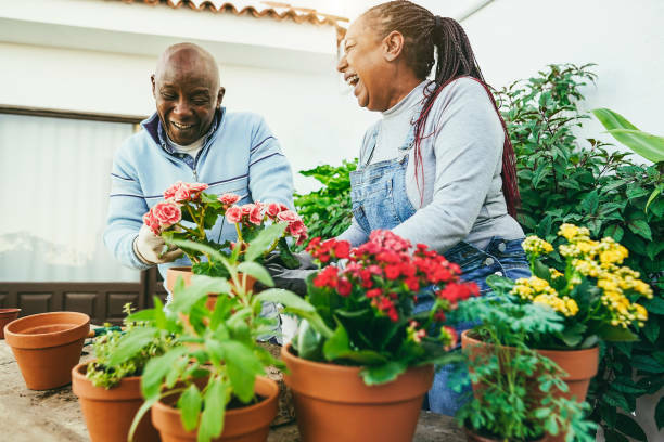 Senior couple enjoying the day gardening together