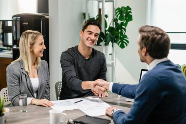 Couple working with advisor sitting across from them