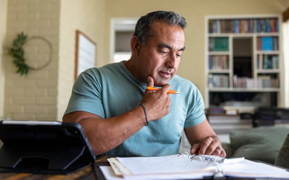 Man reviewing documents at desk