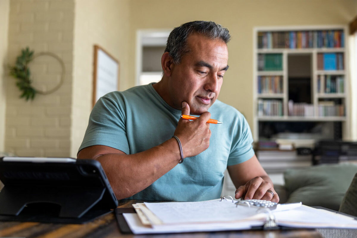 Man reviewing documents at desk