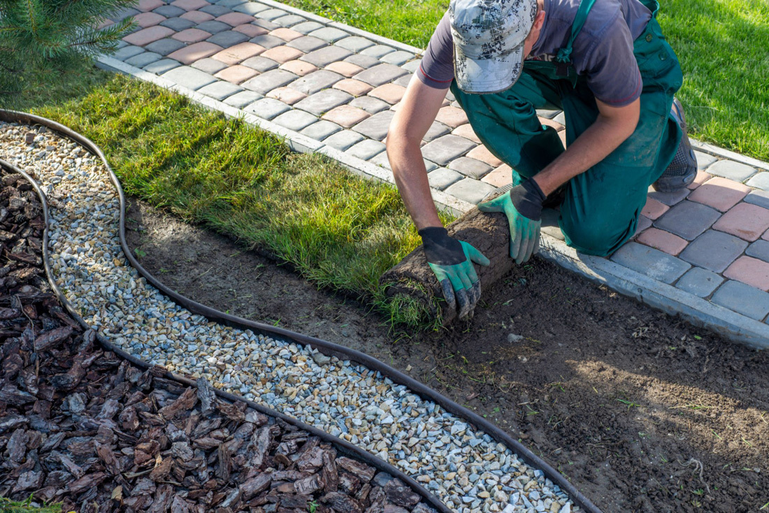 Man landscaping front yard