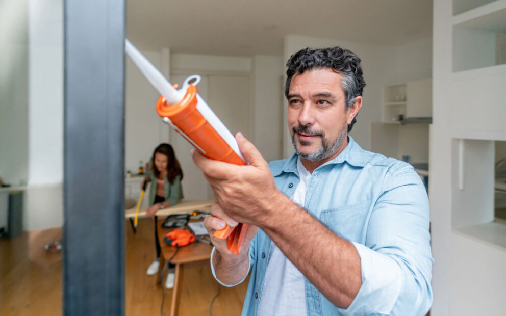 Man and woman making improvments to their kitchen