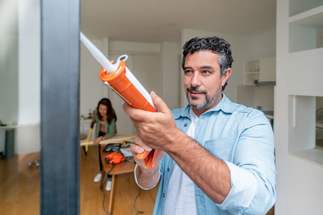 Man and woman making improvments to their kitchen