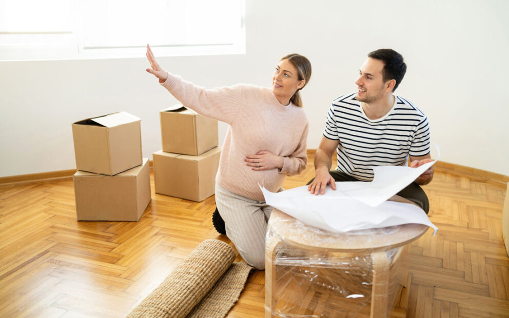 Man and woman moved in, looking around empty room