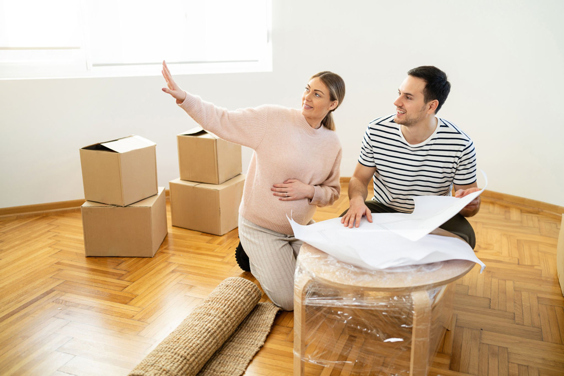 Man and woman moved in, looking around empty room