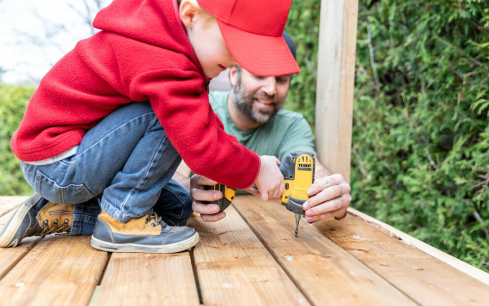 Father & Young Son working on a backyard project.