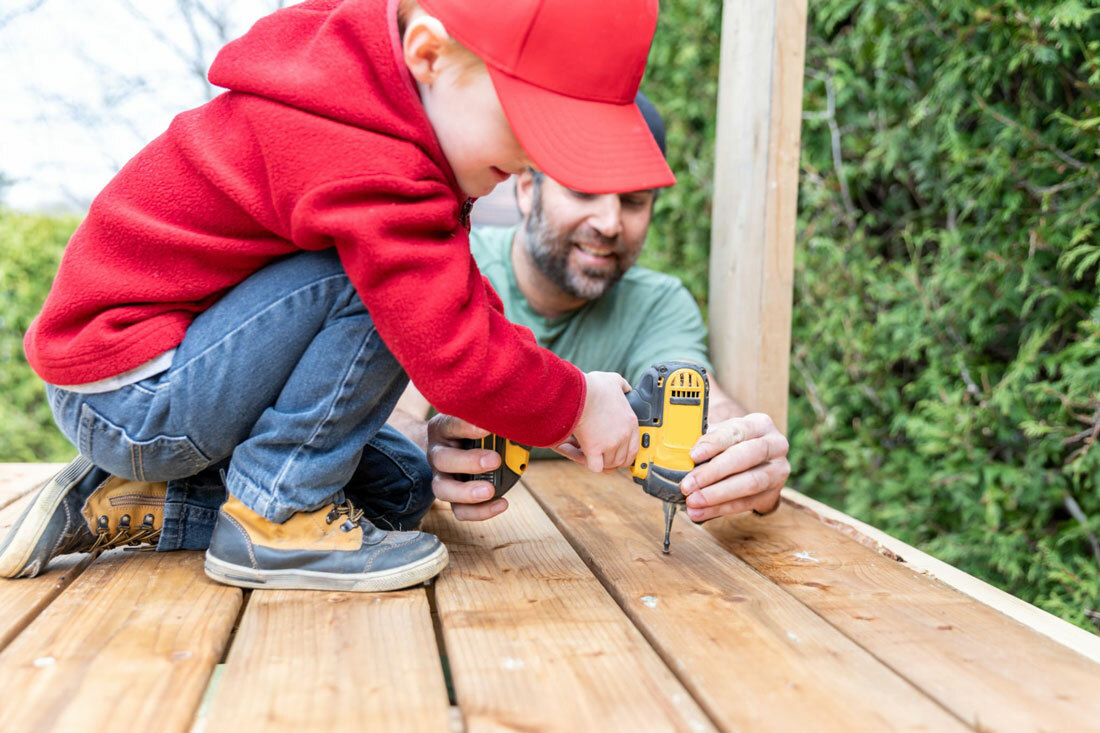 Father & Young Son working on a backyard project.