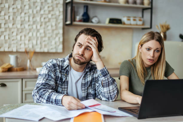 Man and woman reviewing financial documents