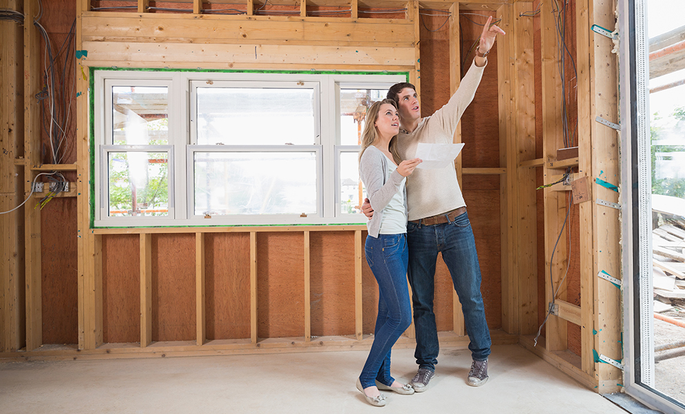Man and woman enjoying newly constructed home