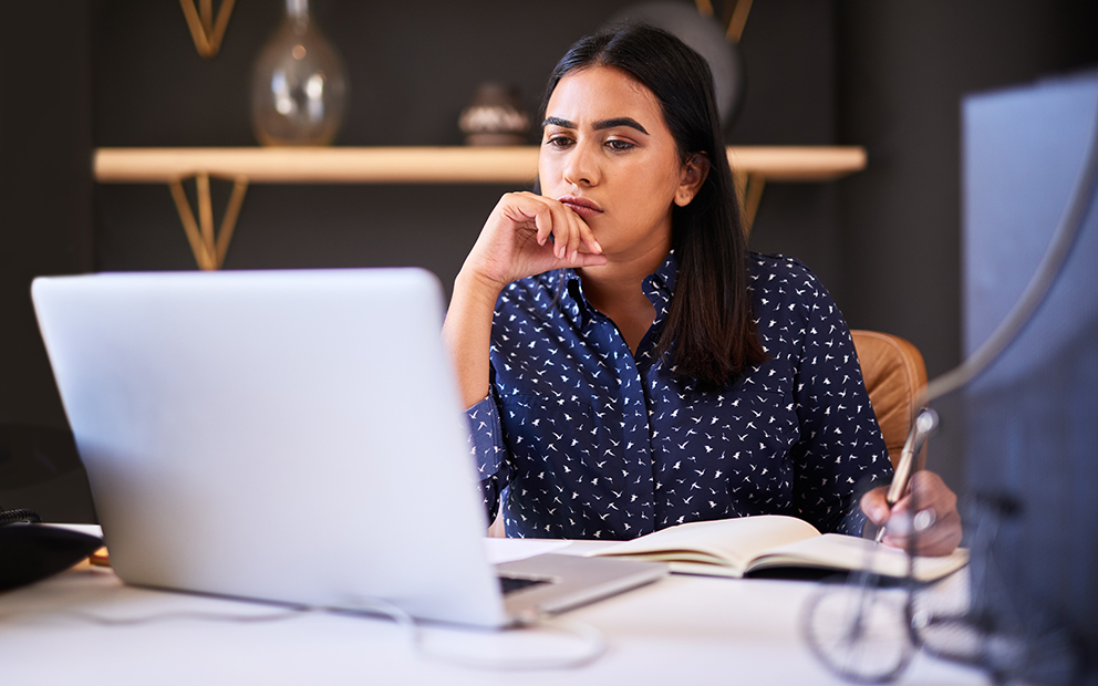 Woman researching information on her computer
