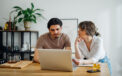 Couple sitting together while reviewing finances