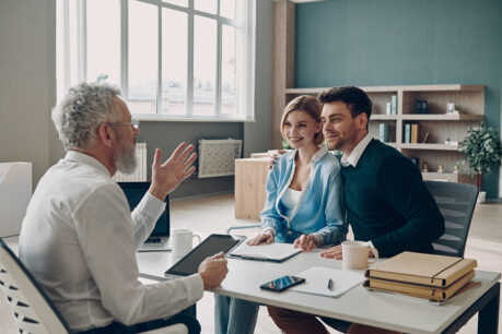 couple sitting at table with advisor