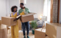 Couple smiling as they pack up their home