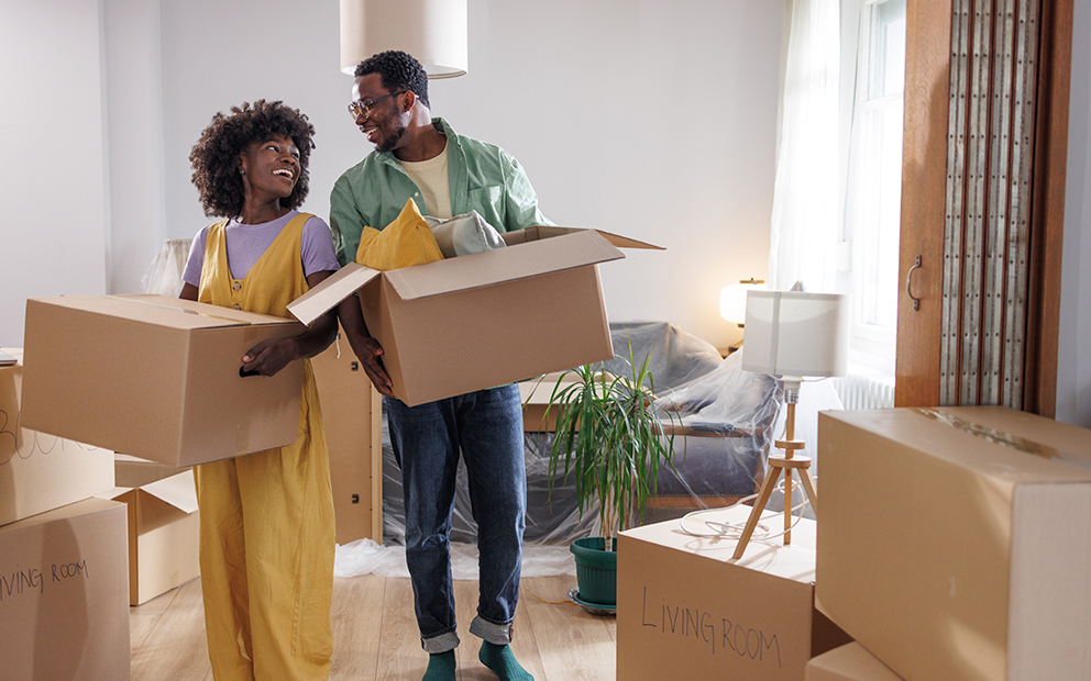 Couple smiling as they pack up their home