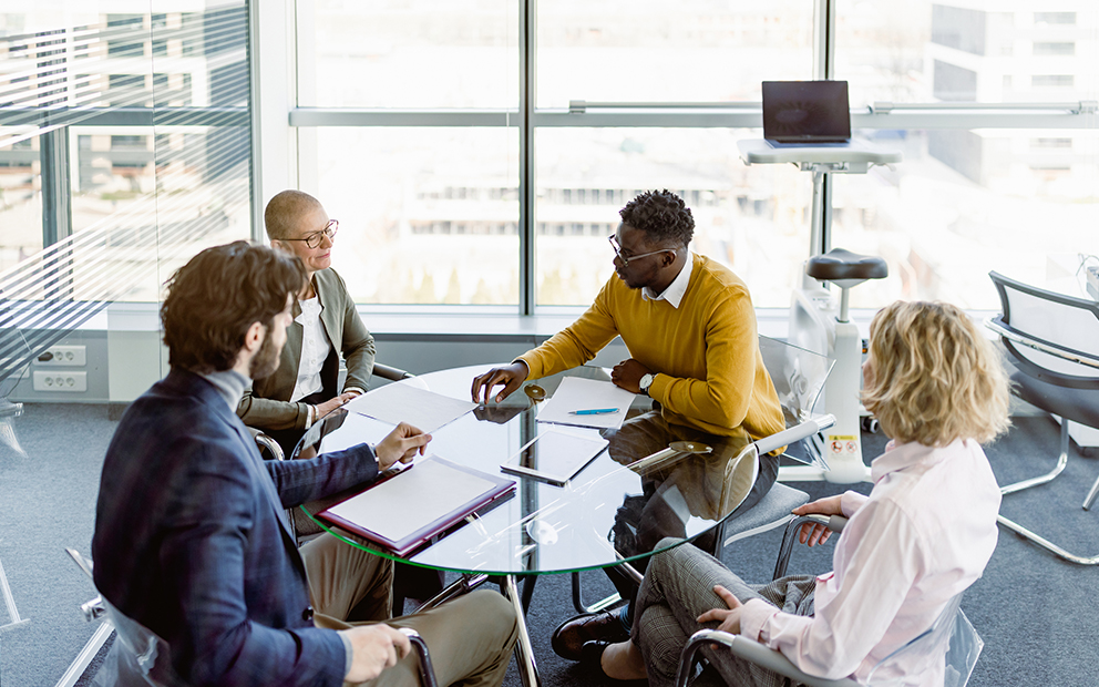 Mortgage professionals sitting and talking together