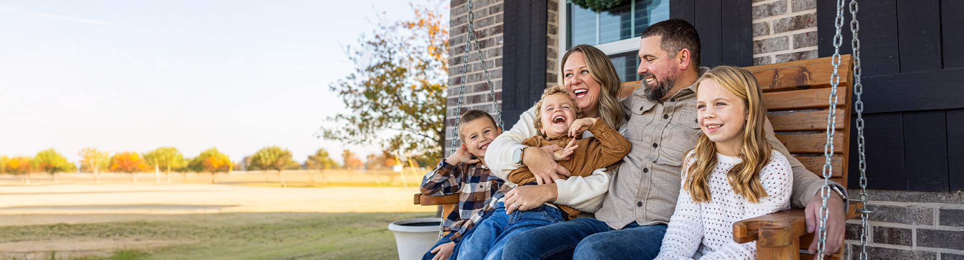 Happy family on porch swing