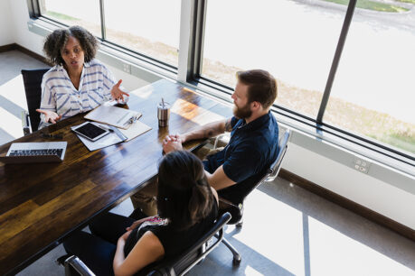 Couple meeting with loan officer in office