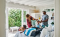 Family unpacking and enjoying vacation home