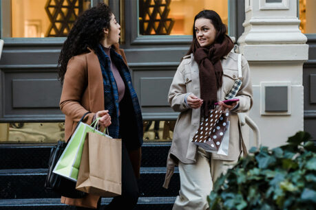 Friends holiday shopping in the city together