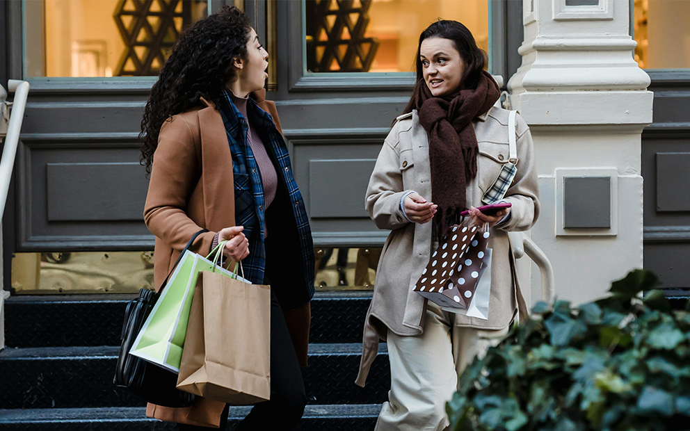 Friends holiday shopping in the city together