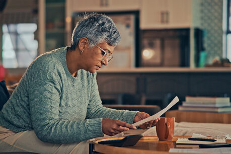 Woman reviewing documents at desk