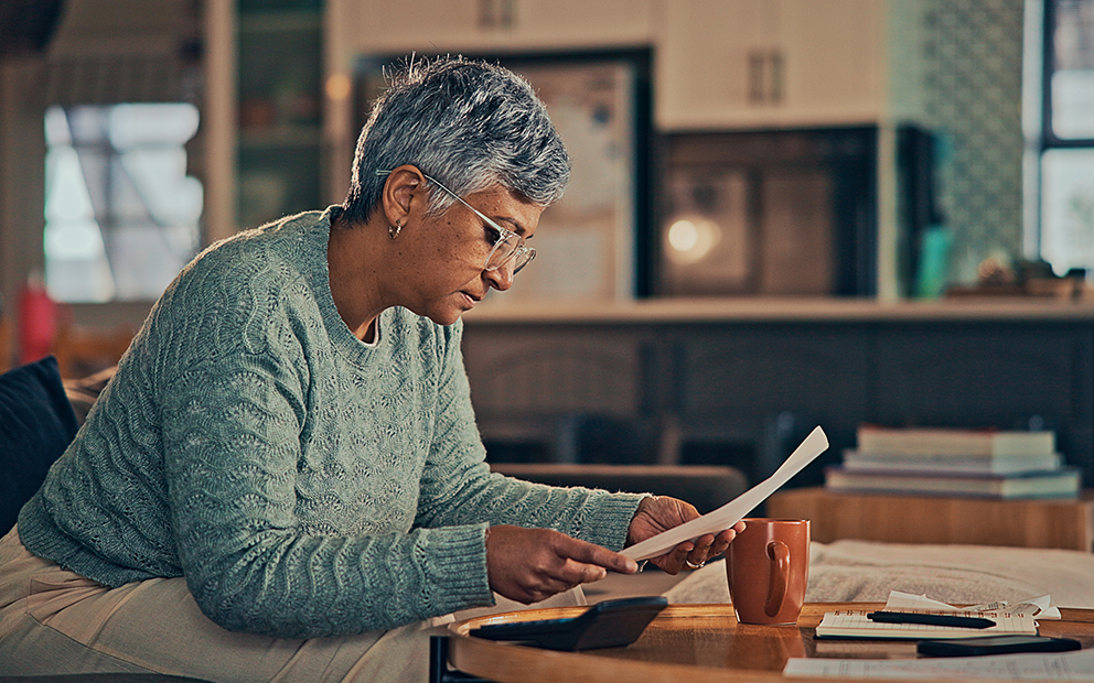 Woman reviewing documents at desk