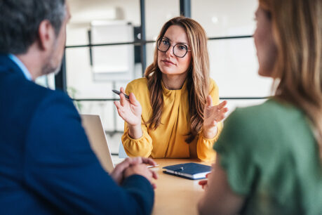 Advisor speaking with couple in office