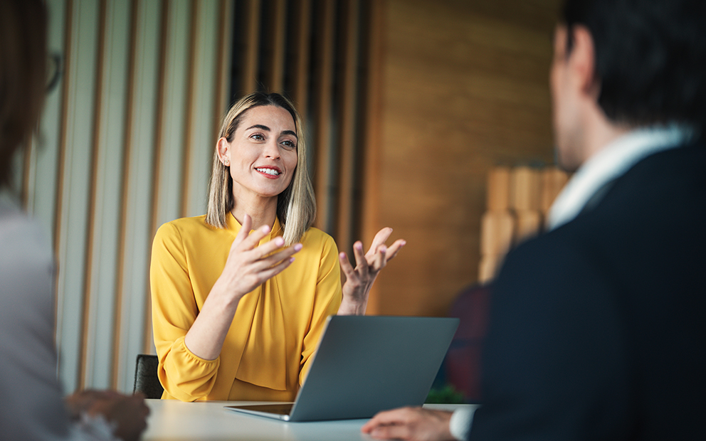 Advisor speaking with client in office
