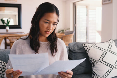 Woman comparing documents
