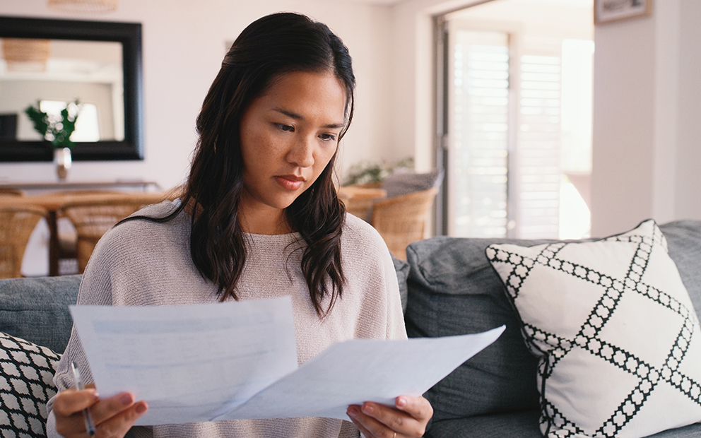 Woman comparing documents