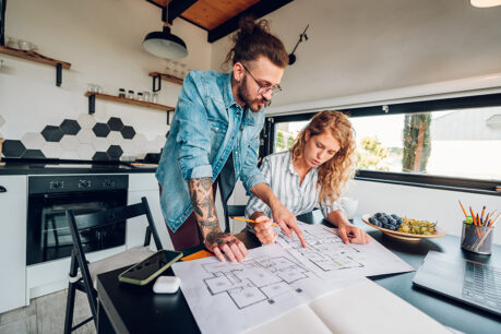 Man and woman couple working on home improvement project in their kitchen