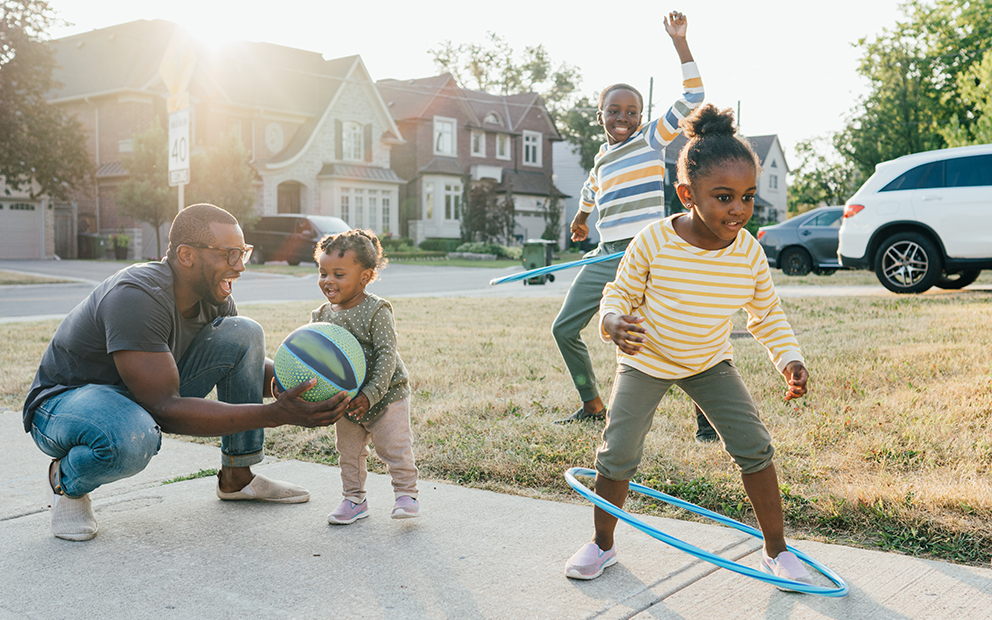 Dad enjoying outdoor activities with his kids
