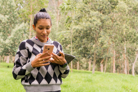 homebuyer assessing land as she prepares to buy land before building a home