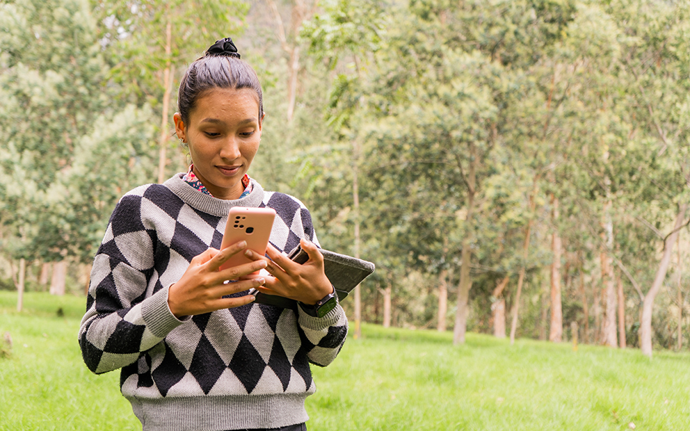 homebuyer assessing land as she prepares to buy land before building a home