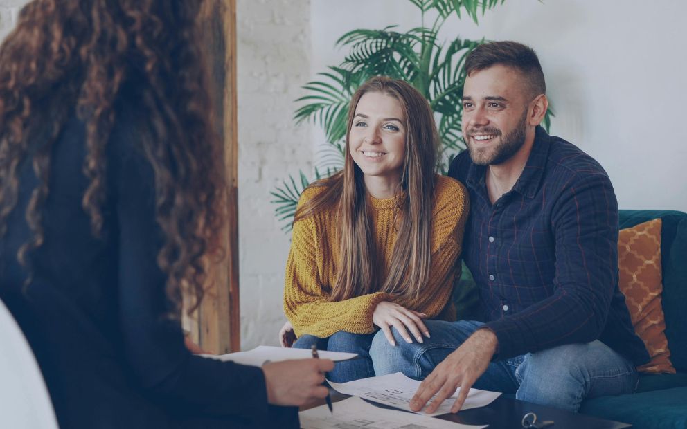 Couple asking banker about when can you use home equity