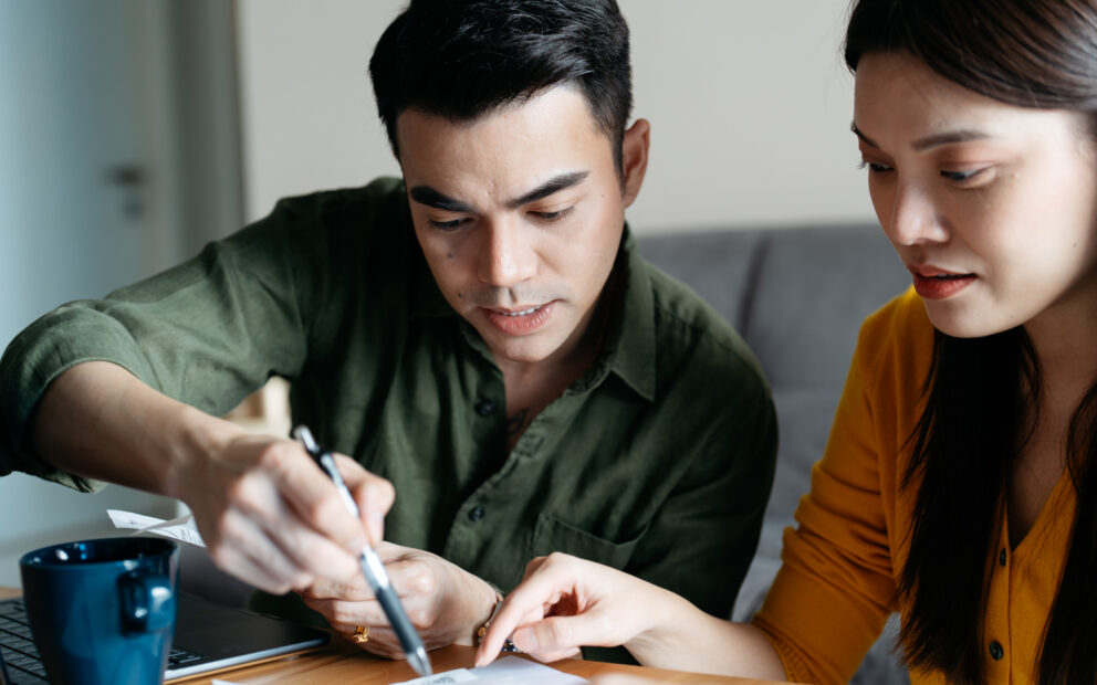 Couple reviewing paperwork related to VA loan down payment